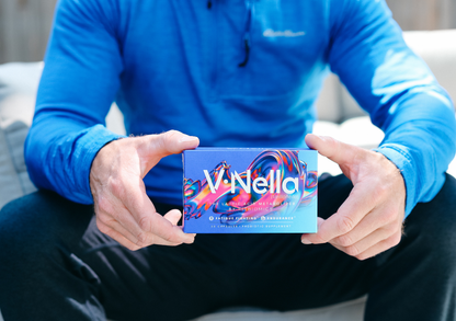 man holding box of v•nella in front of himself