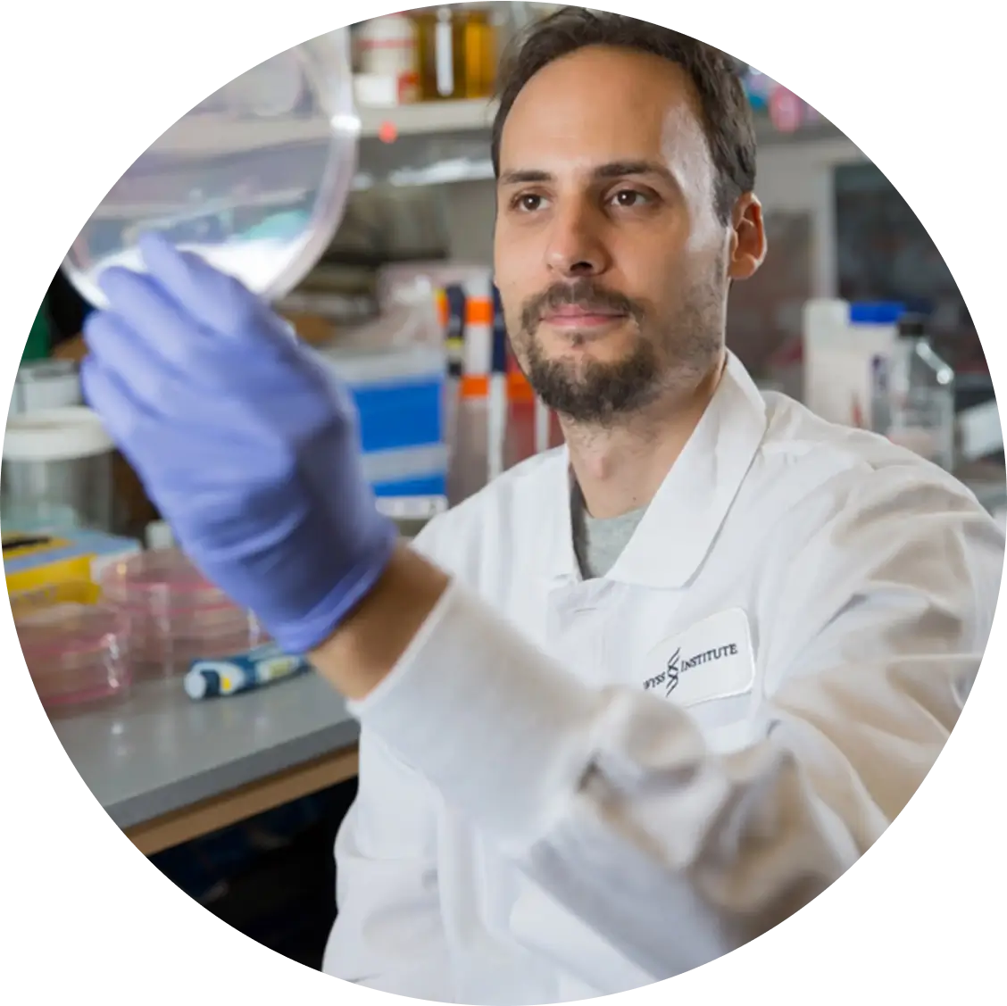 Dr. Jonathan Scheiman, PhD holding up a petri dish