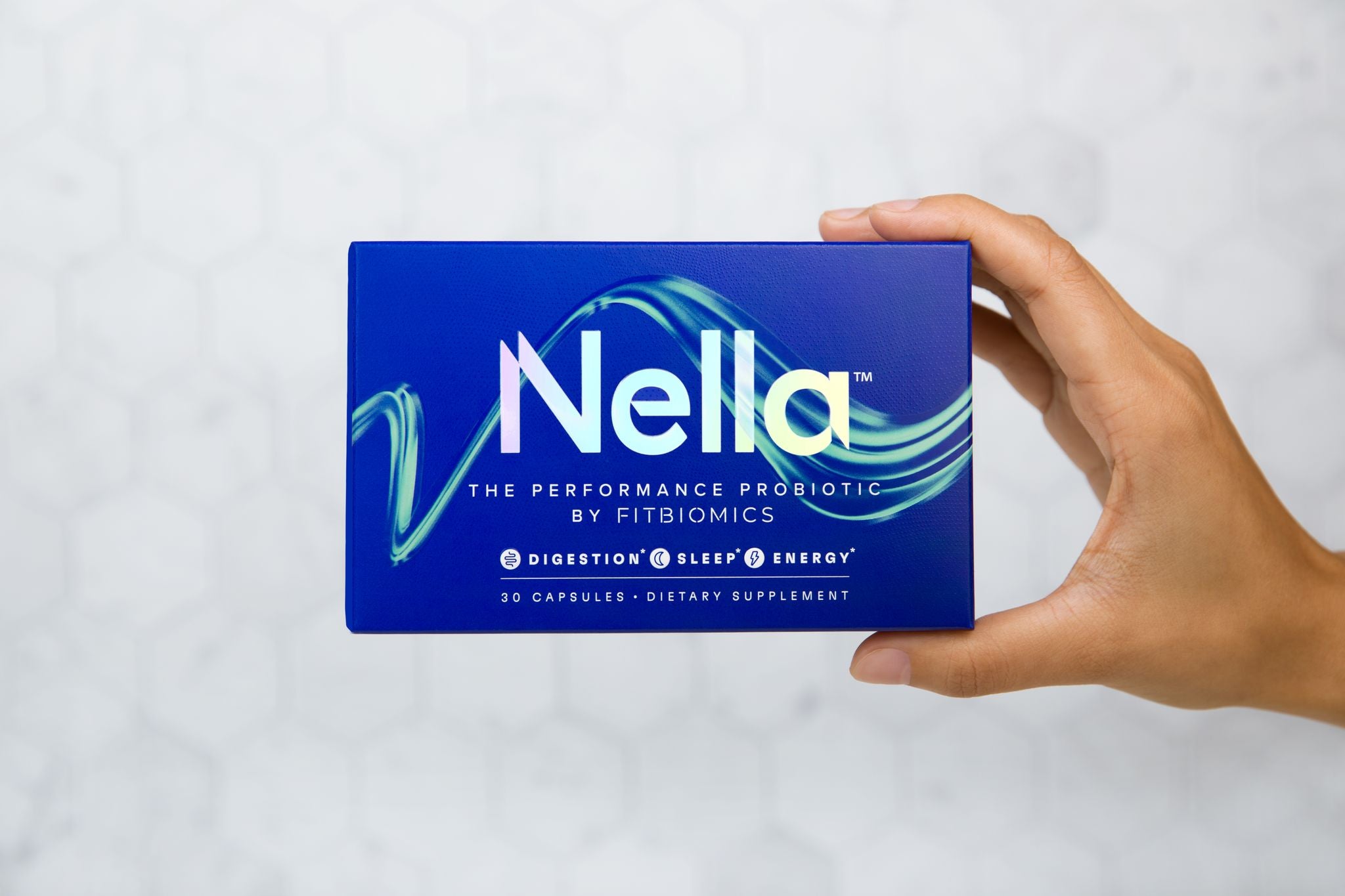 hand holding a box of nella