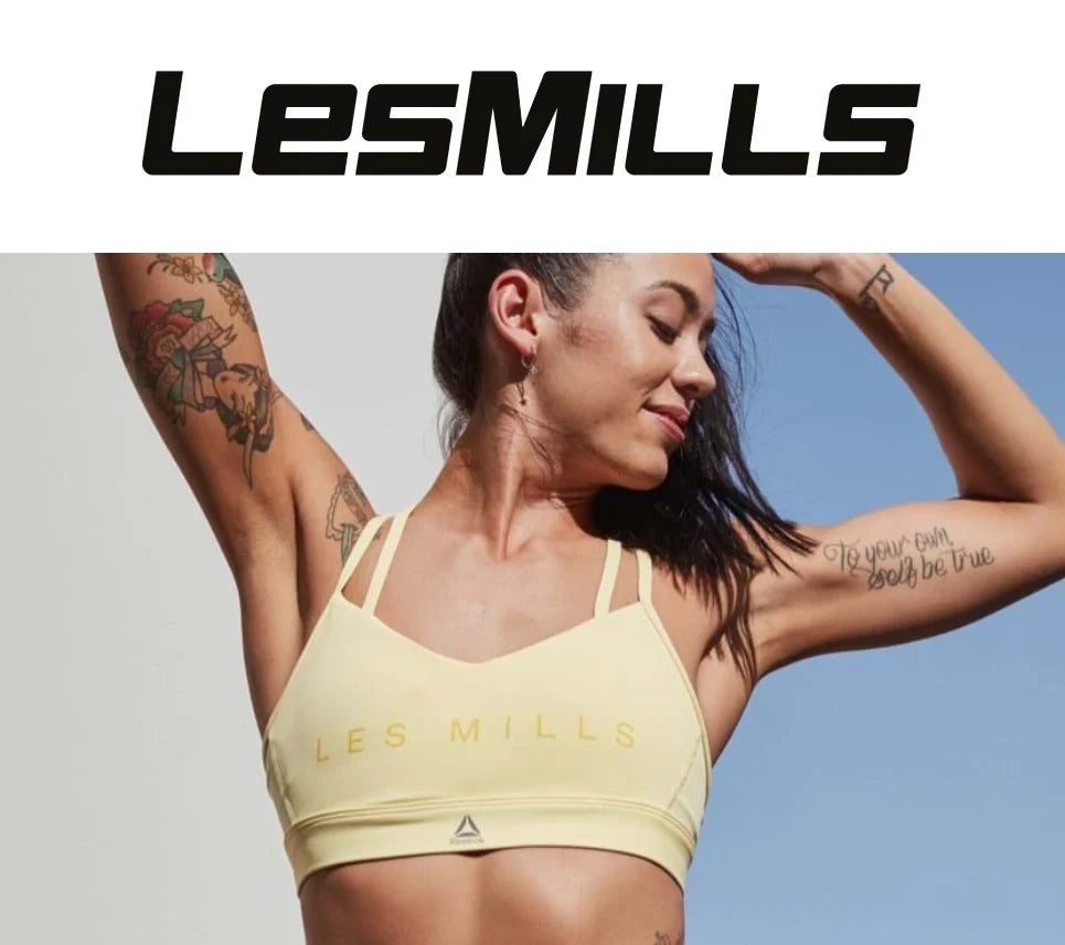 Les Mills logo with woman stretching underneath