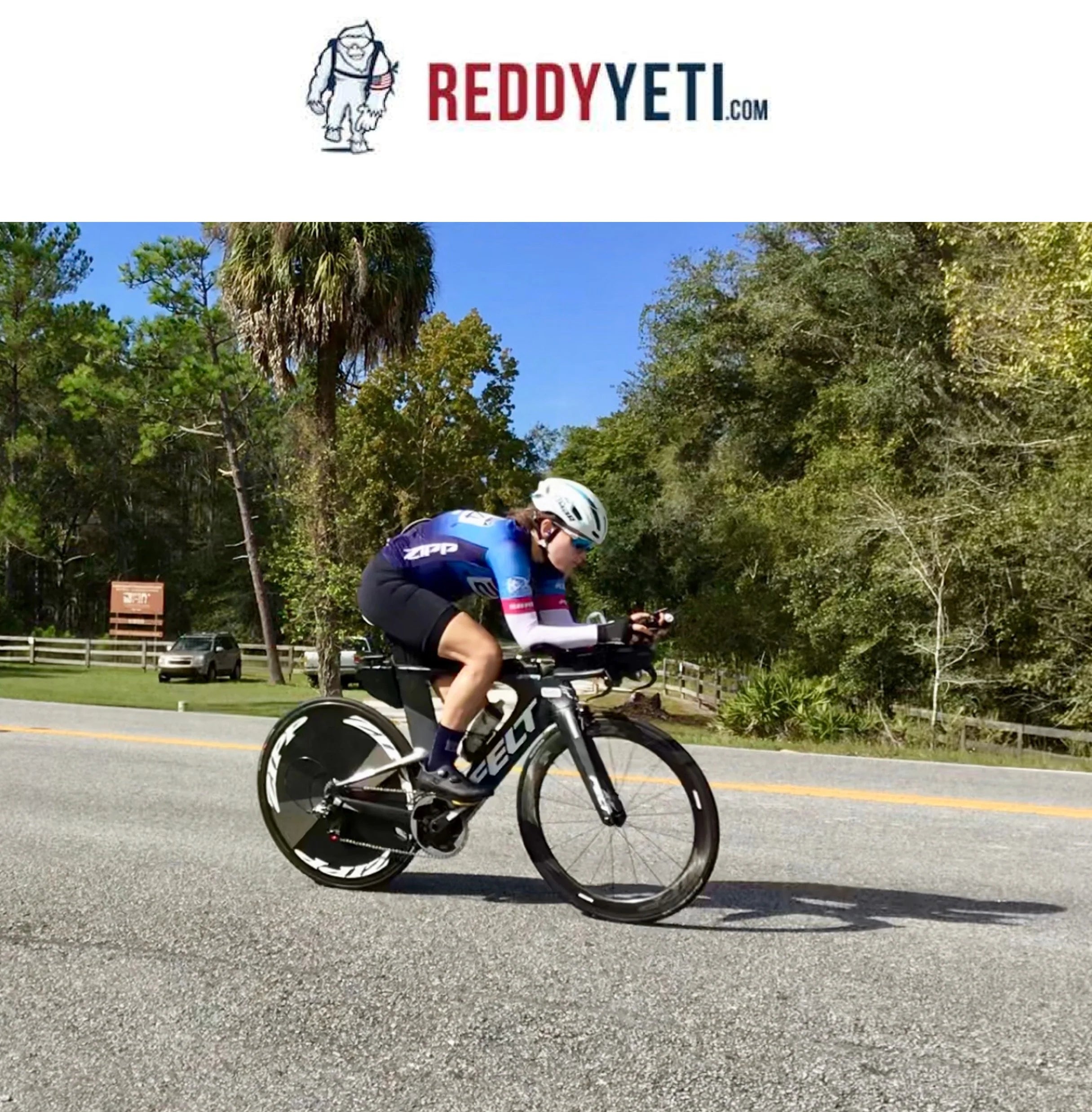 Reddyyeti logo above cyclist on a bike