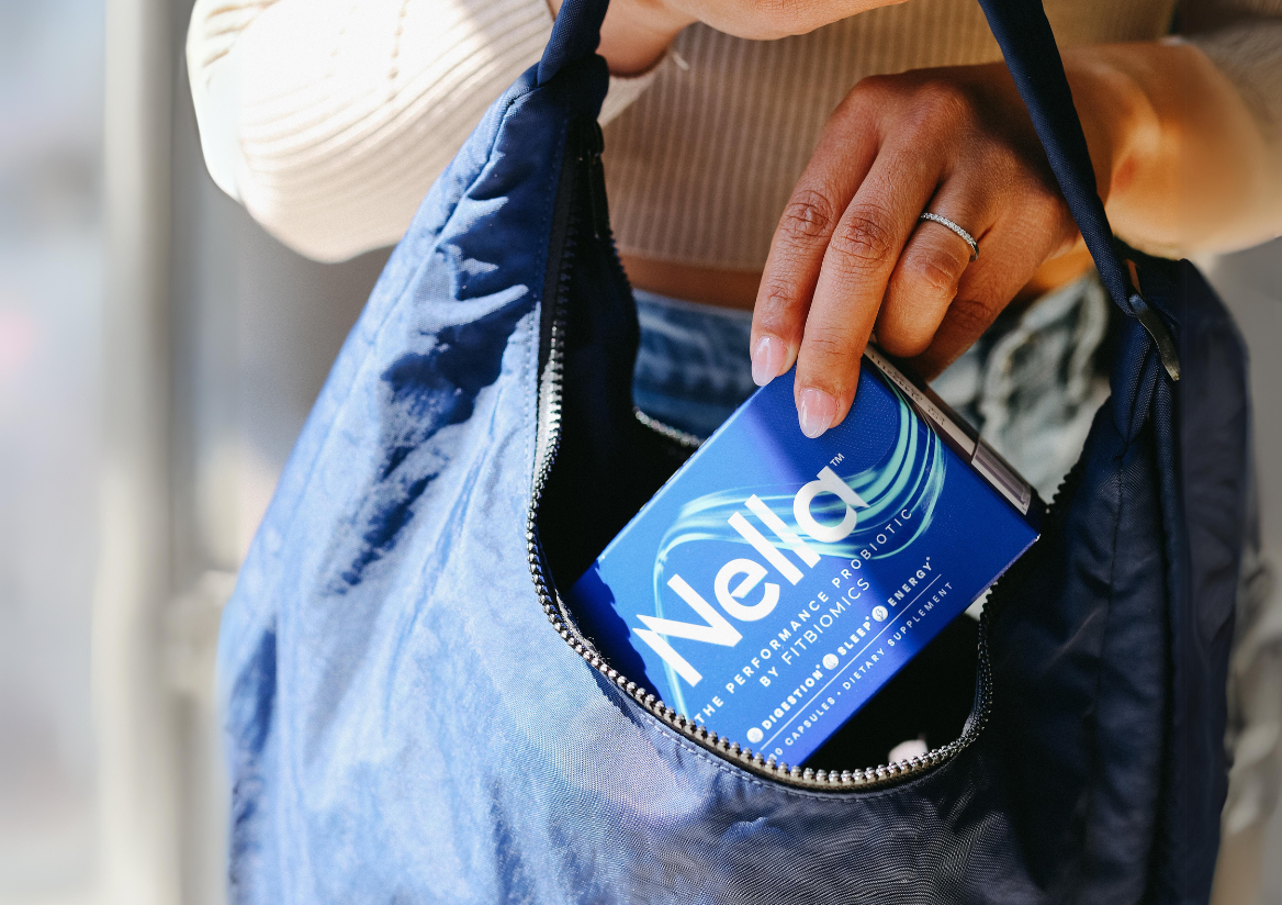 woman putting Nella in her bag